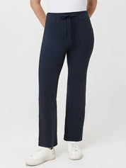 Navy waffle pants worn by a person on a white background