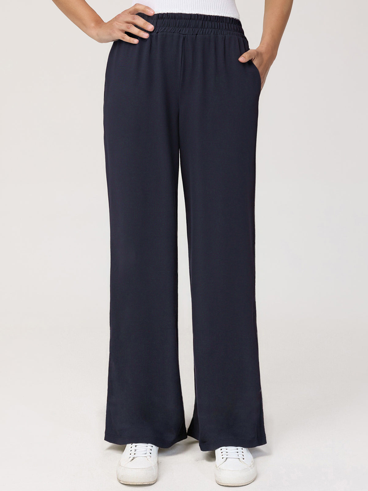 Navy wide-leg pants worn by a person on a white background