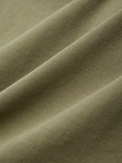 Close-up of olive green fabric with folds