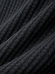 Close-up of black textured fabric with a ribbed pattern