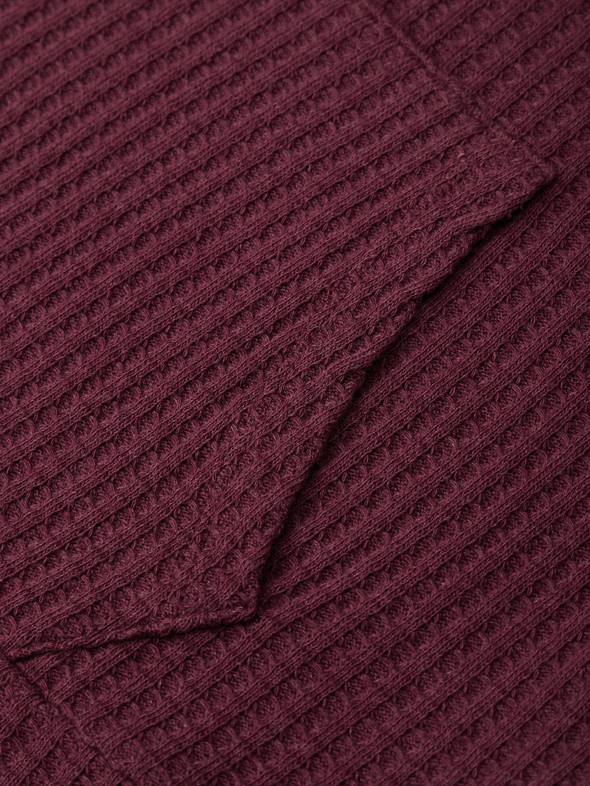 Close-up of a textured burgundy fabric