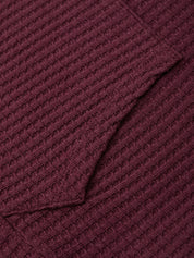 Close-up of a textured burgundy fabric