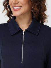Navy blue zip-up pullover worn by a person with a neutral background