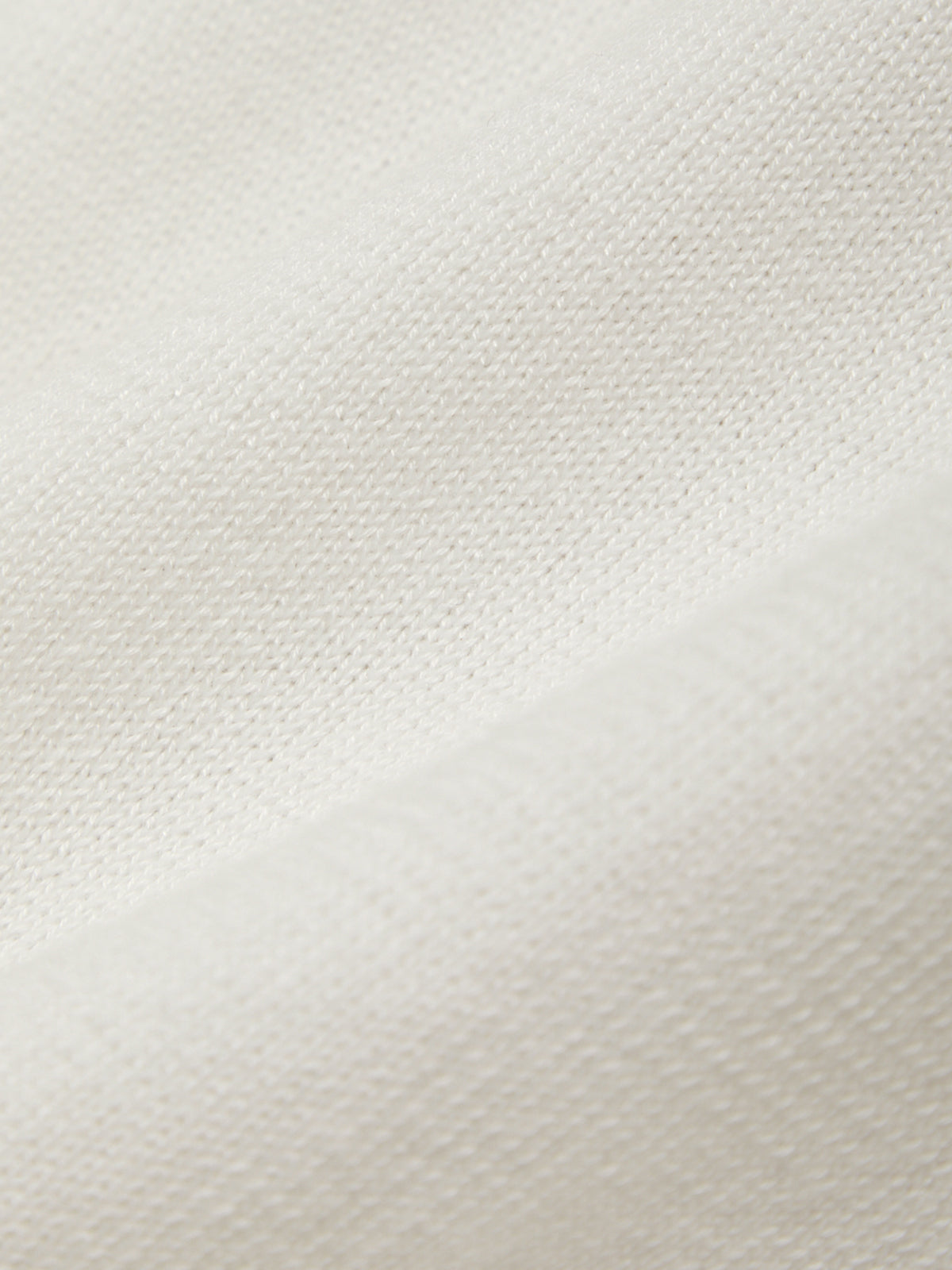 Close-up of a textured white fabric surface