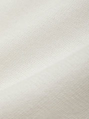 Close-up of a textured white fabric surface