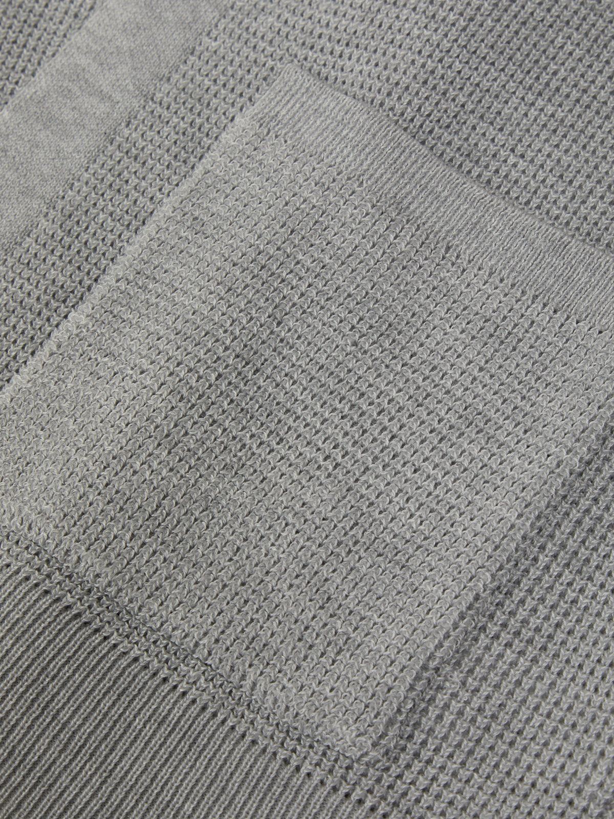 Close-up of a textured gray fabric surface