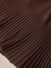 Close-up of a dark brown ribbed knit fabric with a fringed edge, showing the detailed texture and weave.