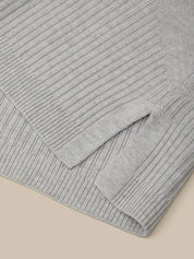 Gray ribbed knit sweater on a beige background