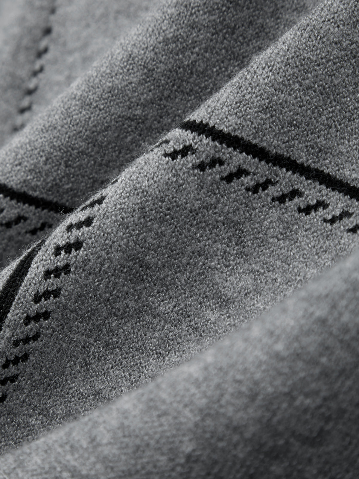 Close-up of textured fabric with stitching detail