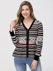 Woman wearing a patterned cardigan with a plain background