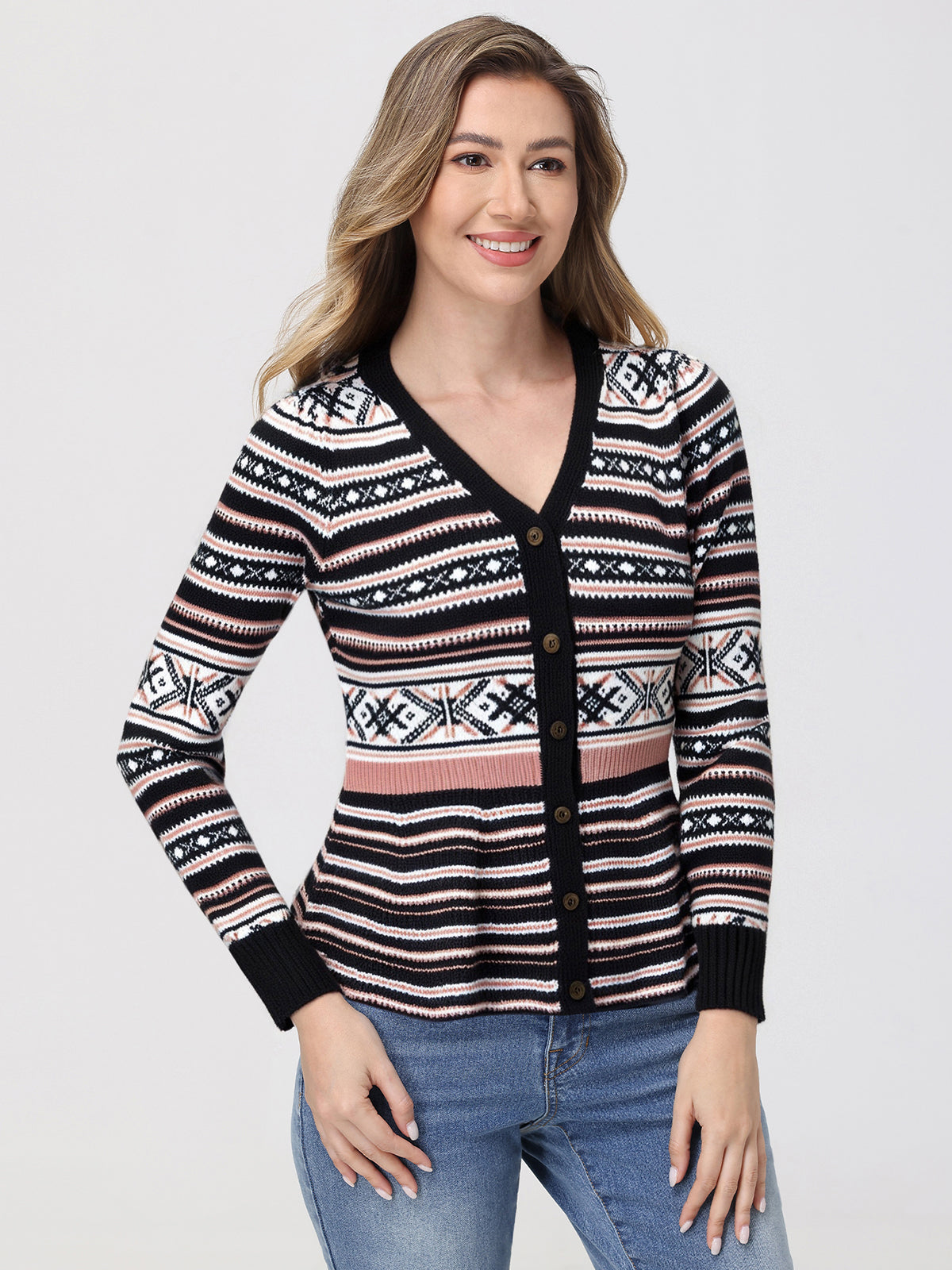 Woman wearing a patterned cardigan on a plain background