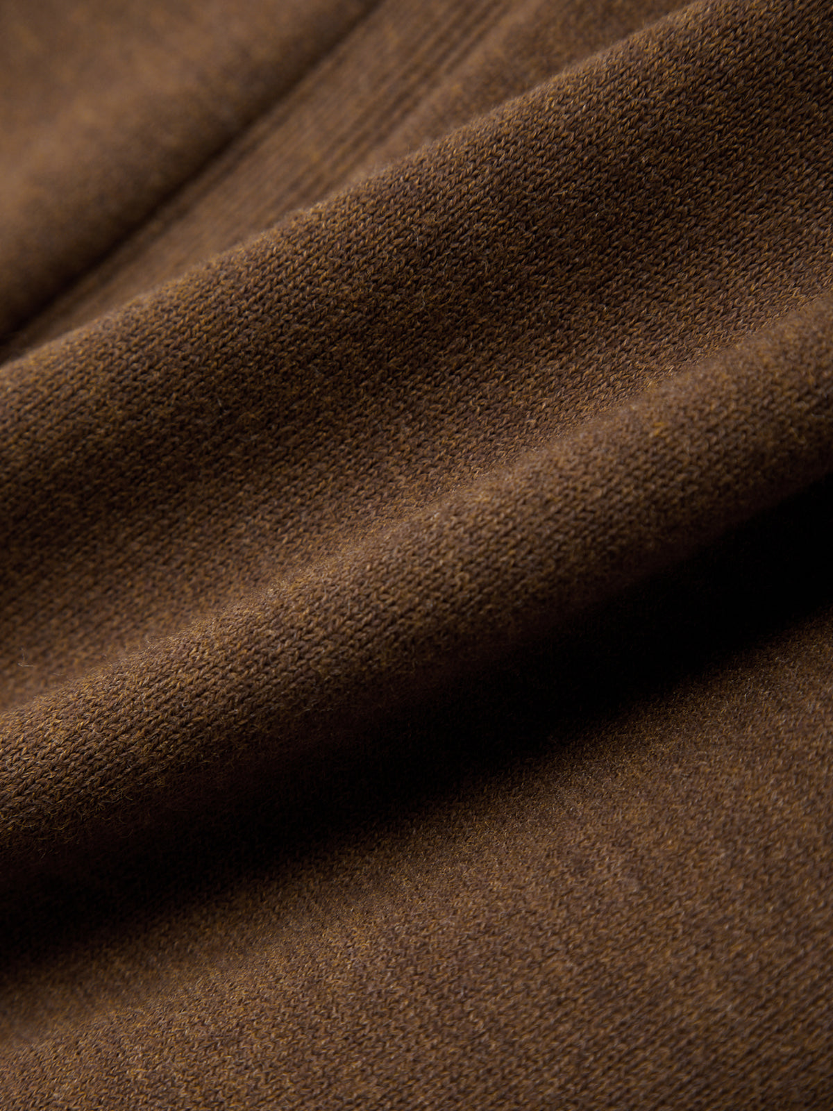 Close-up of brown fabric with a textured surface