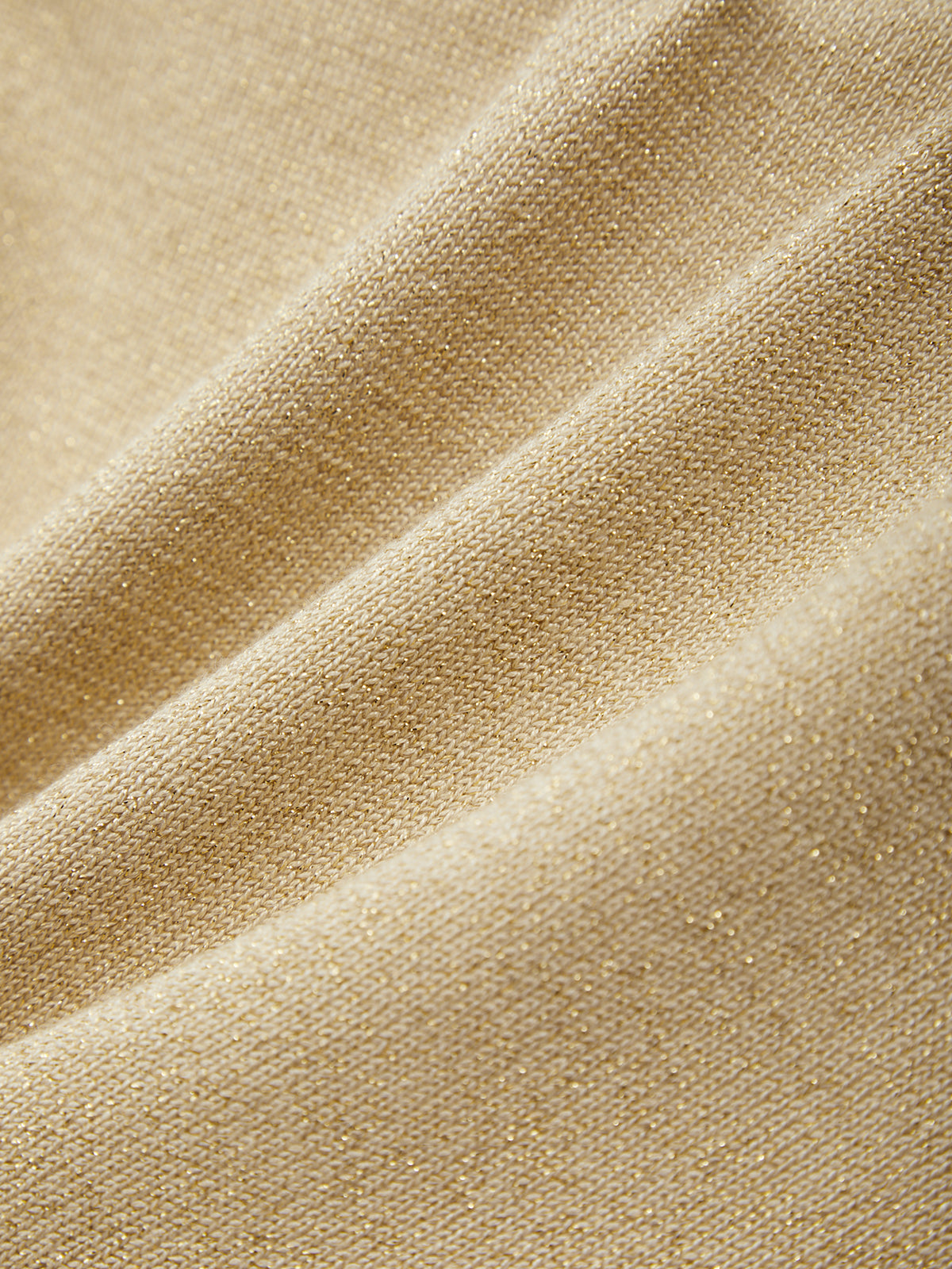 Close-up of beige fabric with a textured pattern