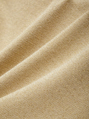 Close-up of beige fabric with a textured pattern