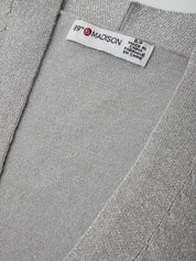 Gray fabric with a brand label on a gray background
