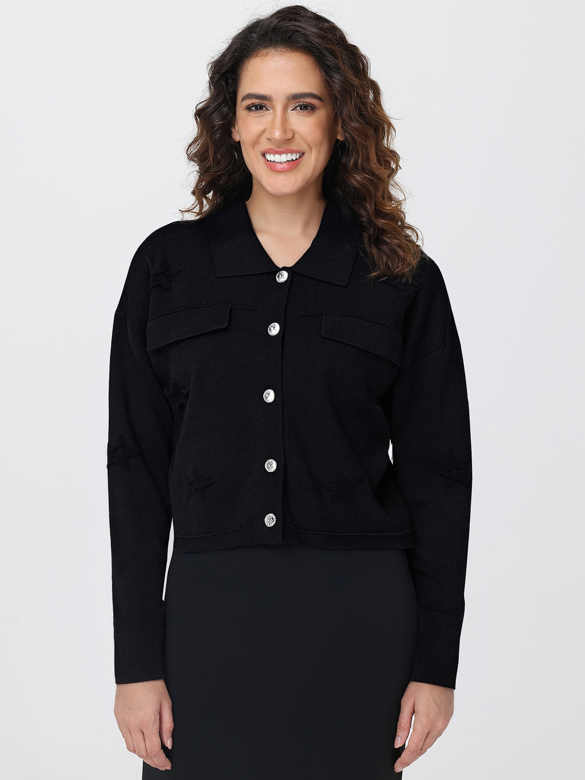 Woman wearing a black cardigan on a white background