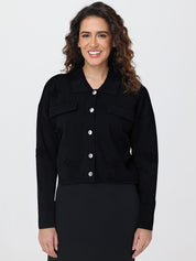 Woman wearing a black cardigan on a white background