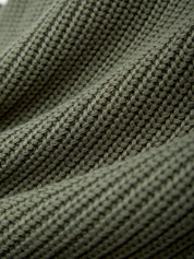 Close-up of green knitted fabric texture