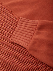 Close-up of a brown textured fabric with a ribbed pattern