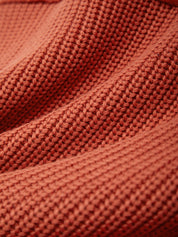 Close-up of a textured red fabric surface