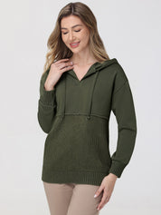 Woman wearing an olive green hoodie on a white background