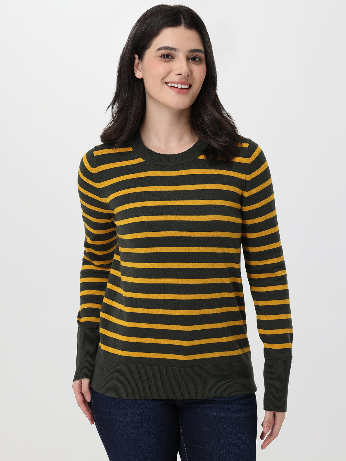 Woman wearing a green and yellow striped sweater on a white background