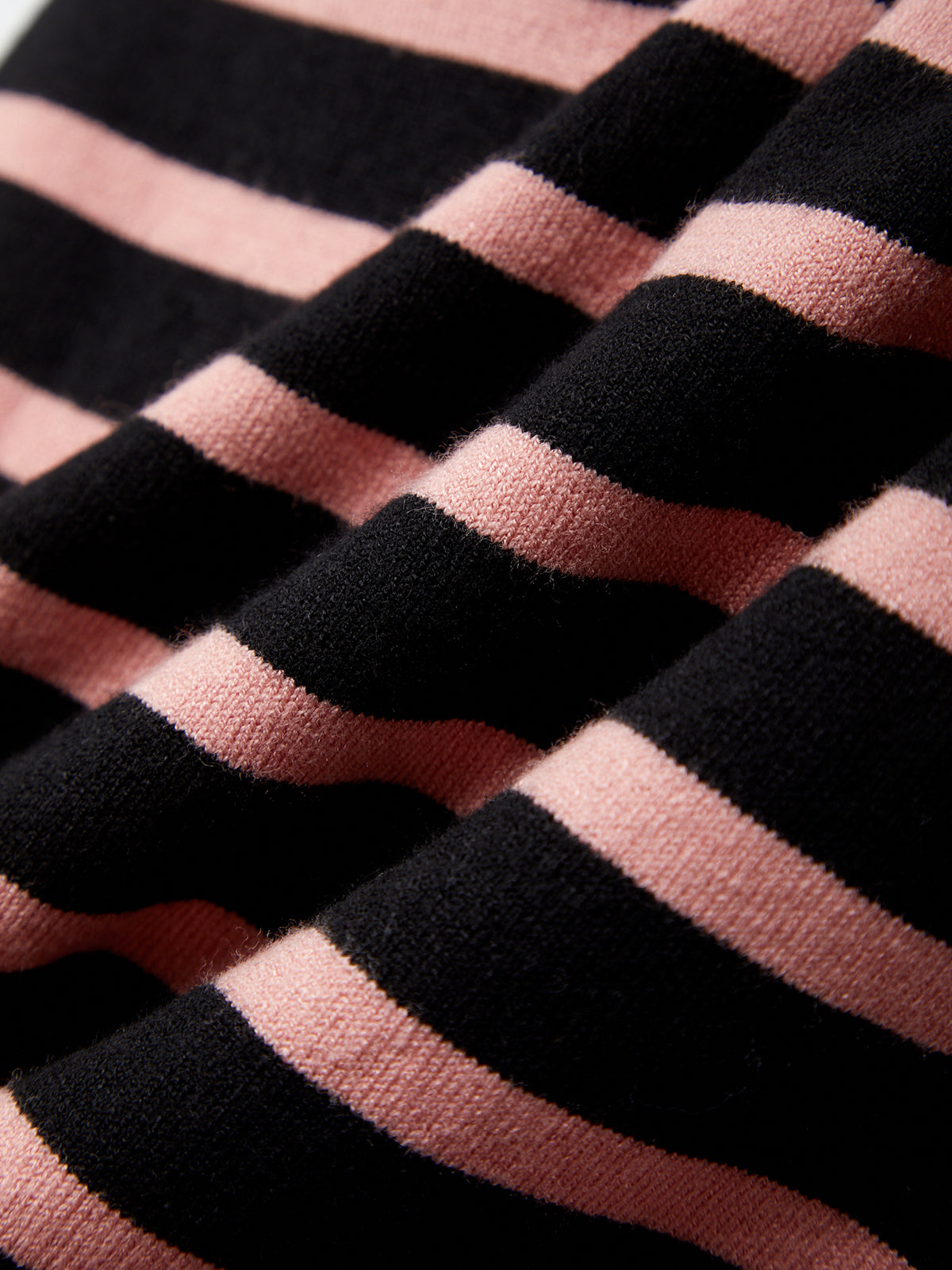 Close-up of black and pink striped fabric