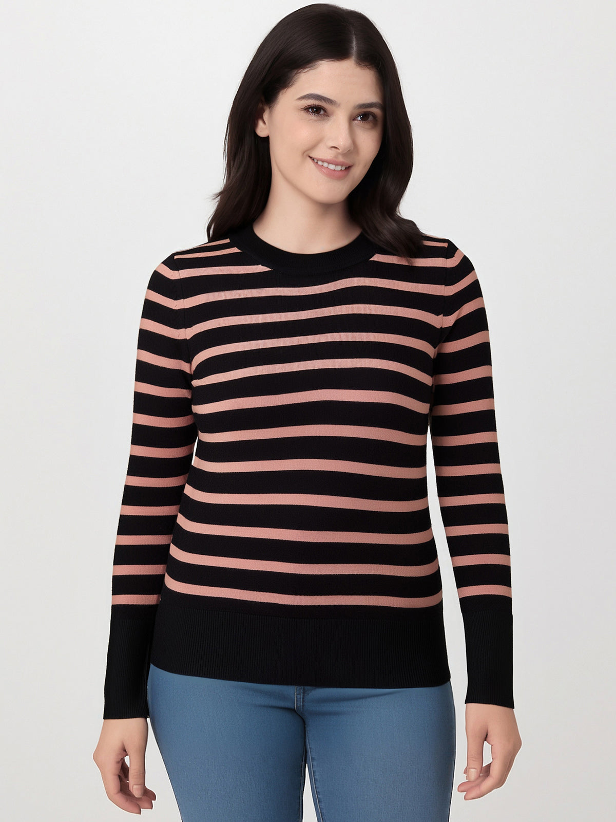 Woman wearing a black and pink striped sweater on a white background
