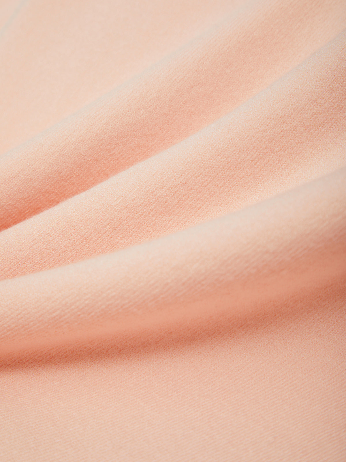 Close-up of pink fabric with subtle texture