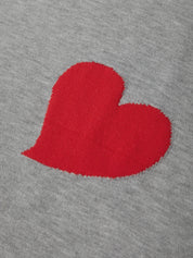 Red heart shape on gray fabric