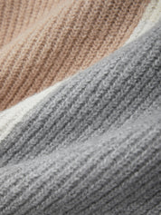Close-up of textured fabric with a gradient from beige to gray.