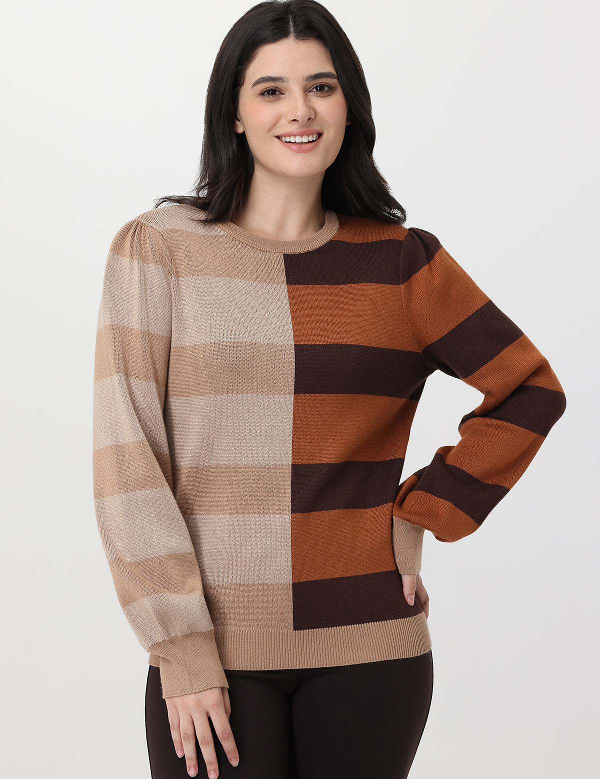 Woman wearing a checkered sweater with brown and beige colors on a white background