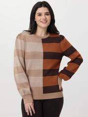 Woman wearing a checkered sweater with brown and beige colors on a white background