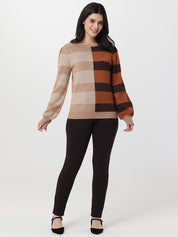 Woman wearing a checkered sweater and black pants on a white background