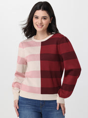 Woman wearing a red and beige striped sweater on a white background