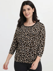 Woman wearing a leopard print top on a white background