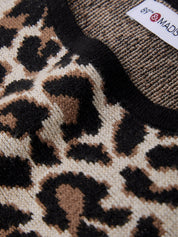 Close-up of a leopard print fabric with a visible brand label.