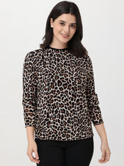 Woman wearing a leopard print sweater on a white background