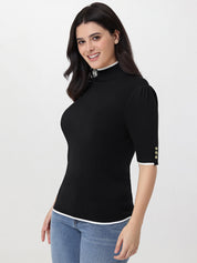 Woman wearing a black ribbed turtleneck sweater with short sleeves on a white background
