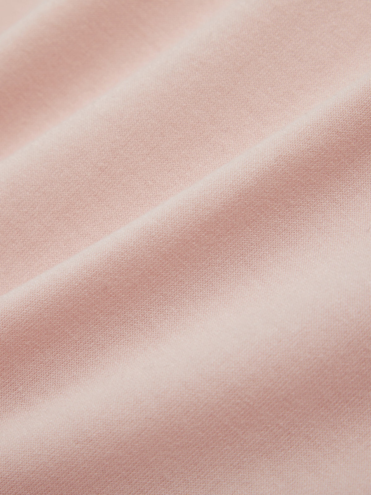 Close-up of pink fabric with a soft texture