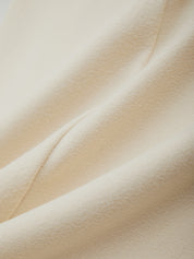 Close-up of beige fabric with a soft texture