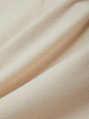 Close-up of beige fabric with a soft texture