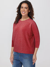 Woman wearing a red tops and blue jeans on a white background