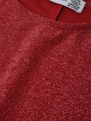Close-up of a red textured fabric with a brand label.