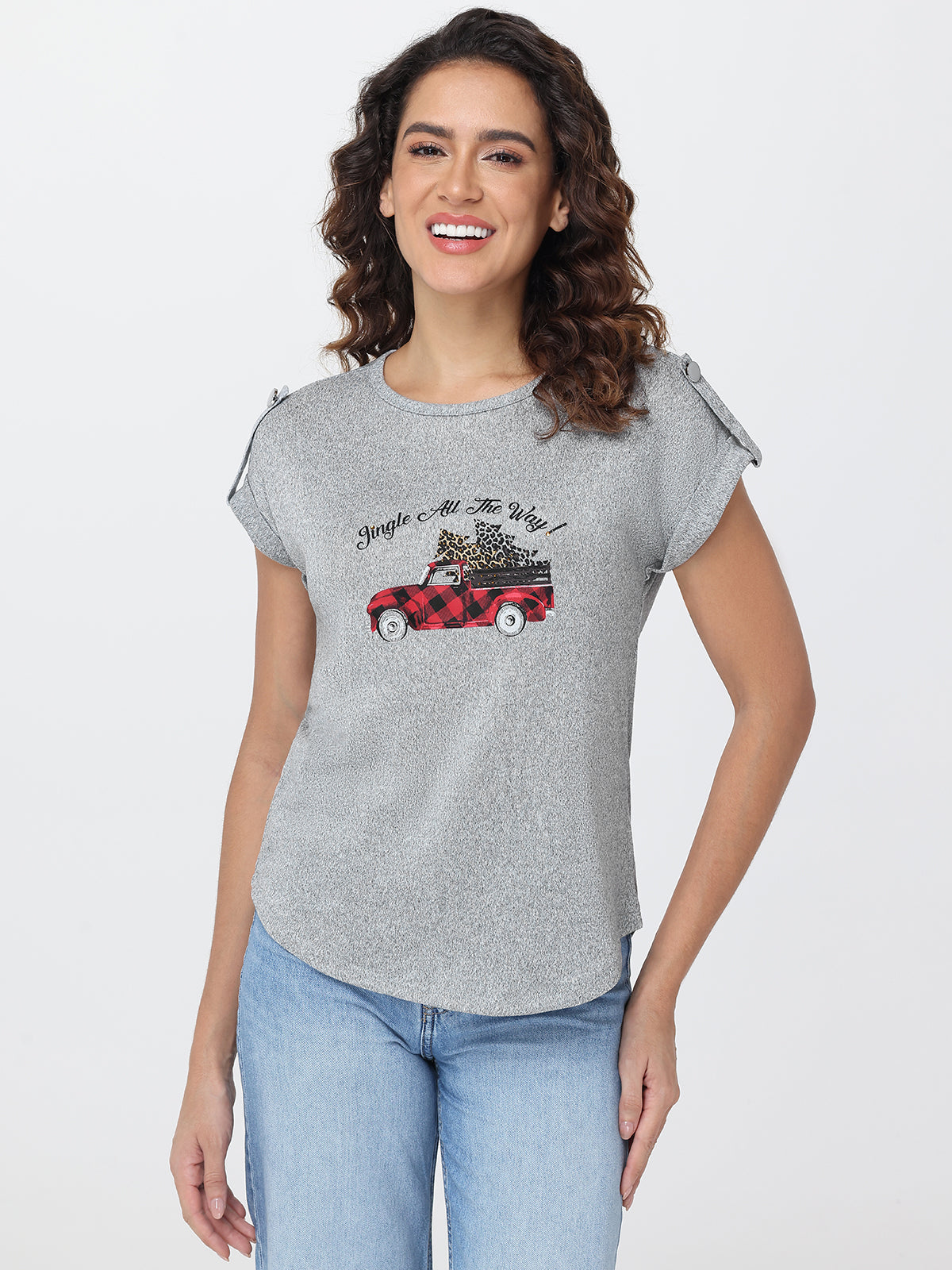 Woman wearing a gray t-shirt with a graphic design on a white background