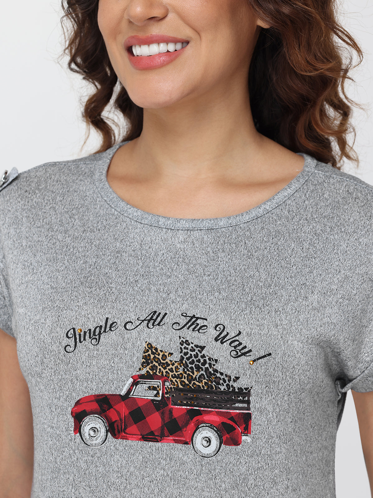 Gray t-shirt with a red truck and 'Jingle All The Way' text design, worn by a person.