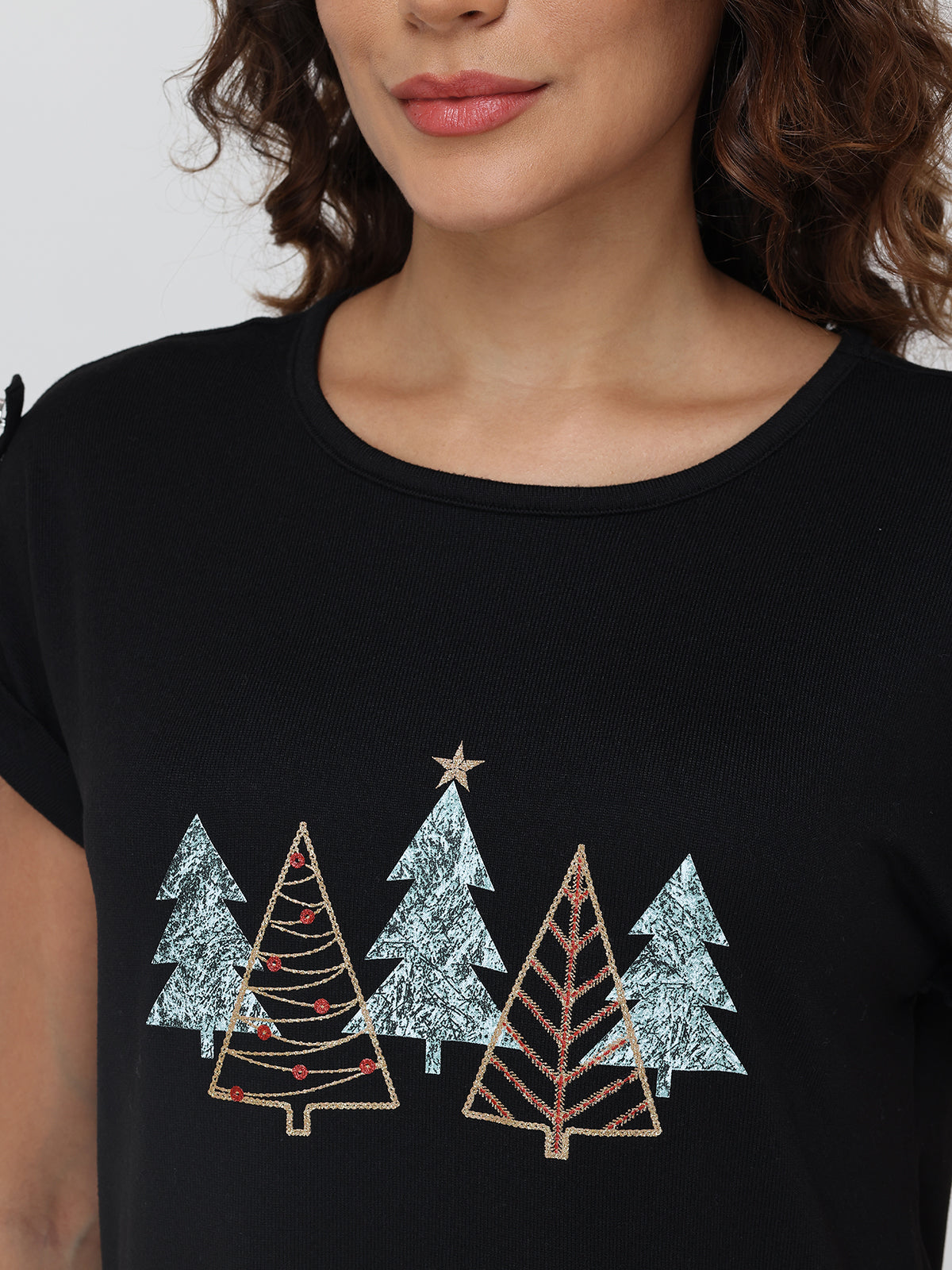Black t-shirt with Christmas tree design worn by a person