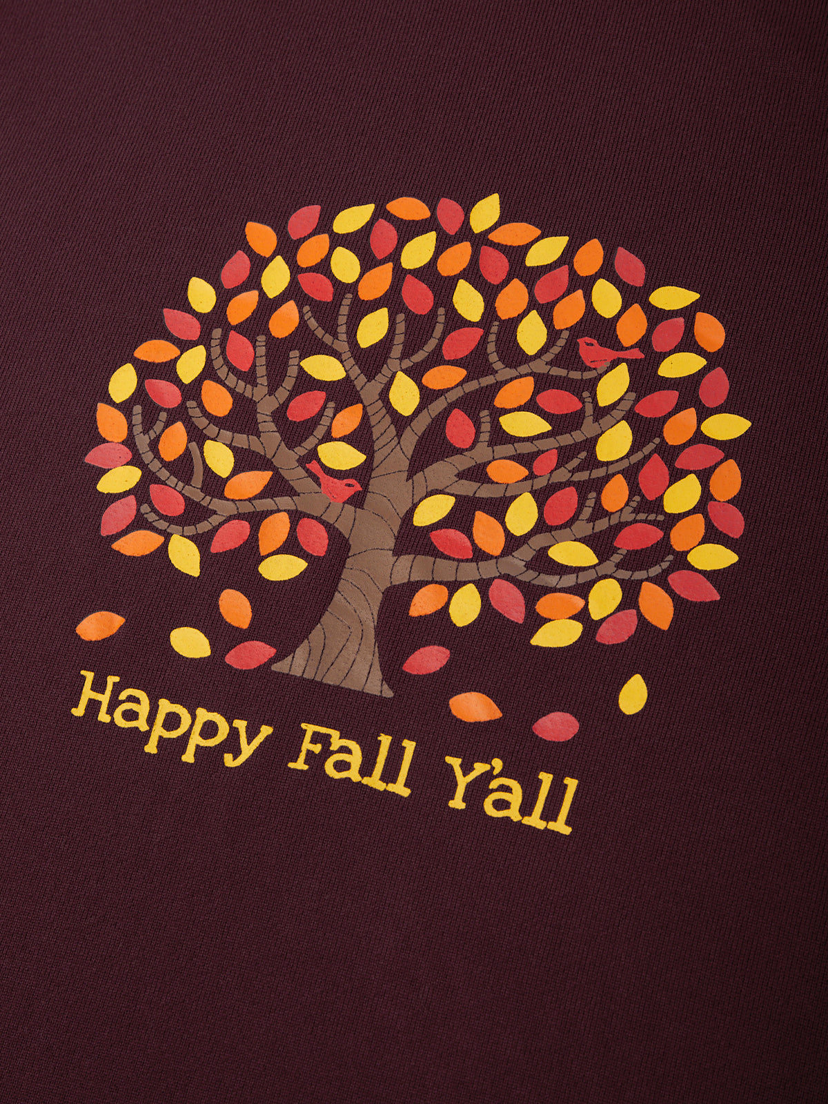 Tree with autumn leaves and 'Happy Fall Y'all' text on a maroon background