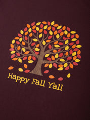Tree with autumn leaves and 'Happy Fall Y'all' text on a maroon background