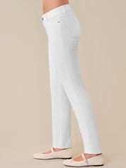 White pants worn by a person on a beige background